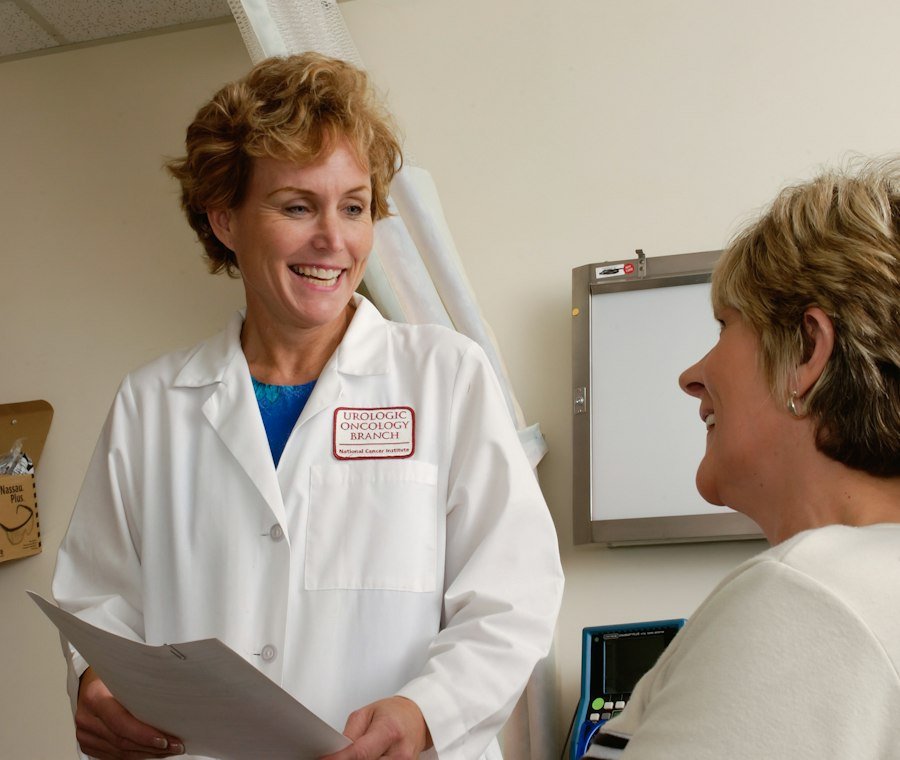 Senior woman reviewing her health coverage with a care provider